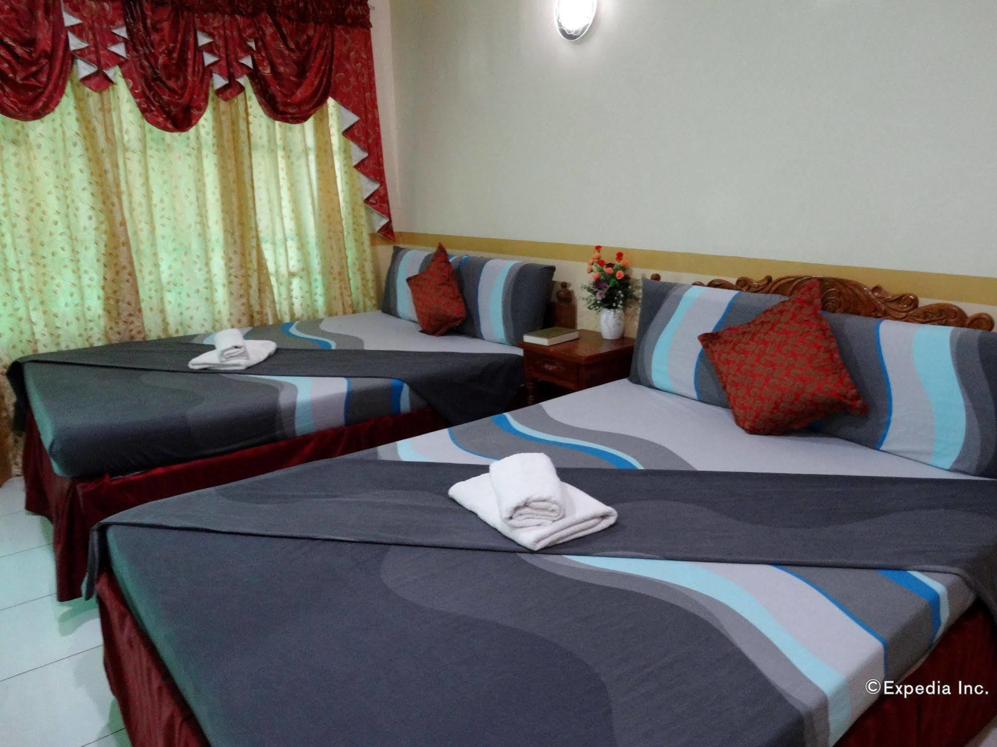 D'Lucky Garden Inn & Suites Tiniguiban Екстериор снимка